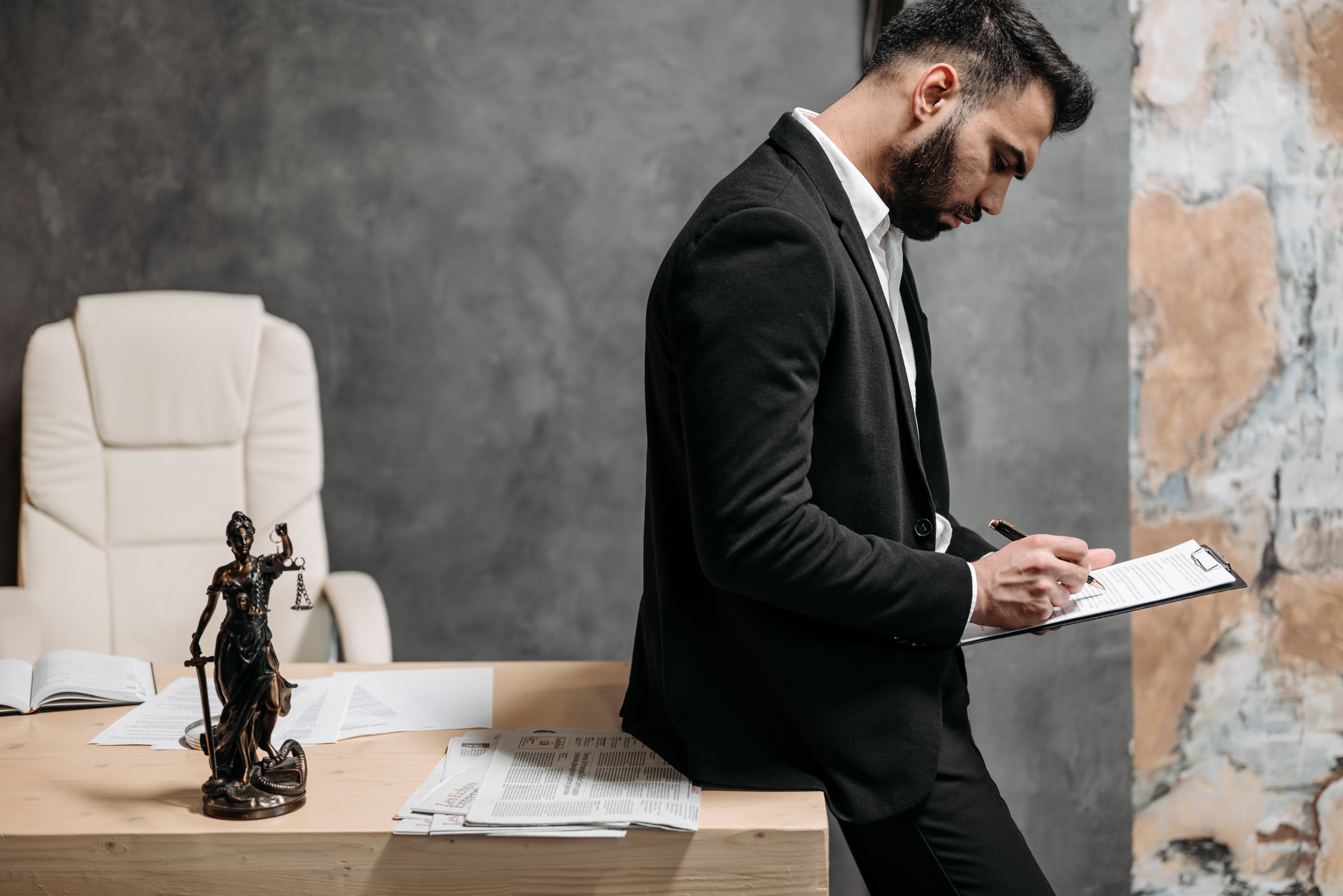 Lawyer carefully reviewing case documents in a professional office