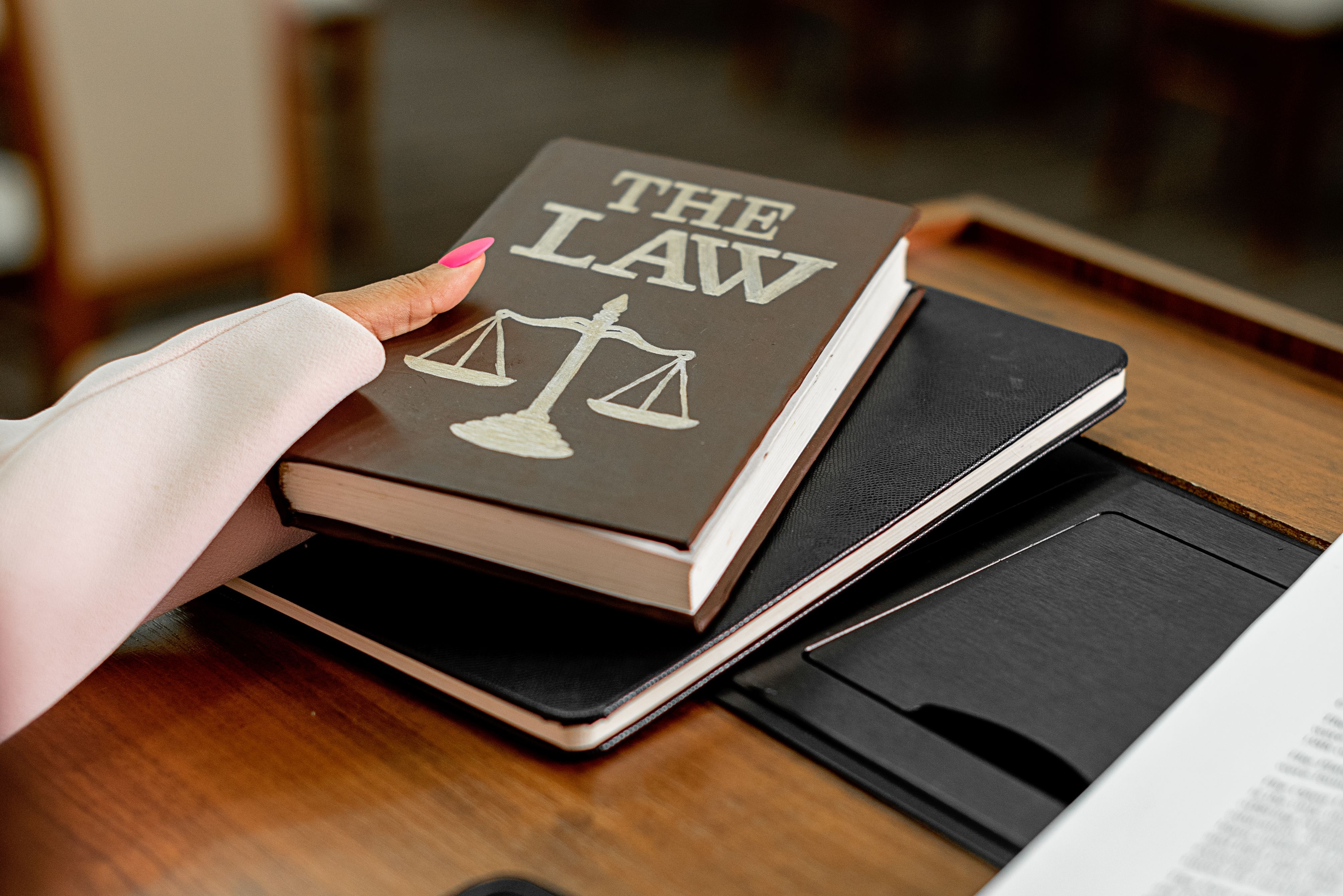Law book and scales of justice representing legal research and international law